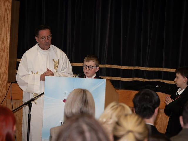 Year 8 readers Shea and Noah pictured with Fr. Shaun Doherty during Thursday's Induction Mass.
