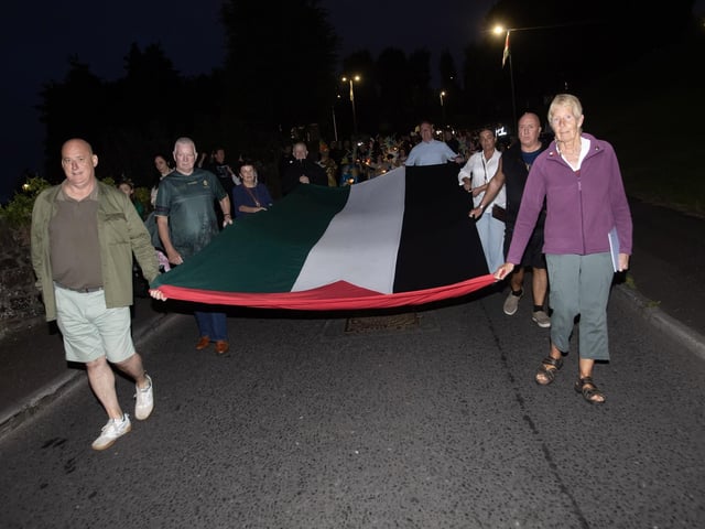 The Palestine flag being carried proudly at Friday night's Feile '25 'Solas Procession'. (Photos: Jim McCafferty Photography) : .