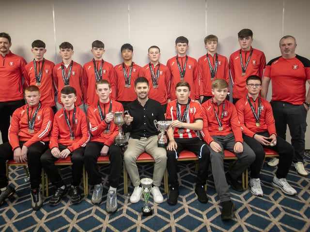 Special guest Stephen McKendry presenting Tristar U-14s with their trophies at the Annual D&D Youth FA awards on Friday night. Included are coaches Paul Cassidy and Brendan McNabb. (Photos: Jim McCafferty Photography)