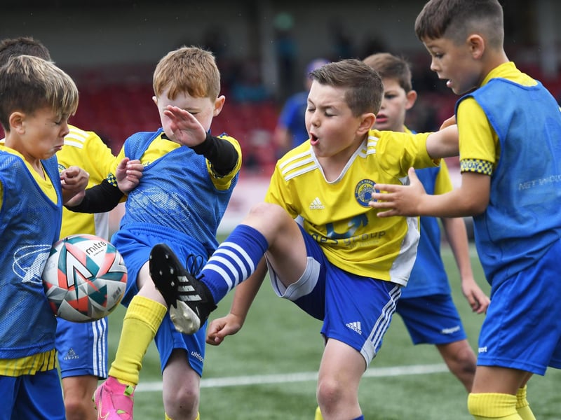 Moyola Youth striker Jack McFerran battles with a packed Dungannon Youth defence during their O'Neills Foyle Cup Under-8's final at The Brandywell.