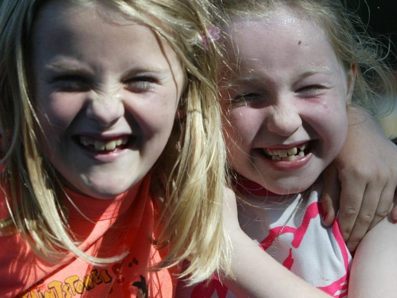 Claudy friends Emma connolly and Marria Moore have some fun in the sun. (0808JB99):Derry youngsters enjoying summer in August 2003