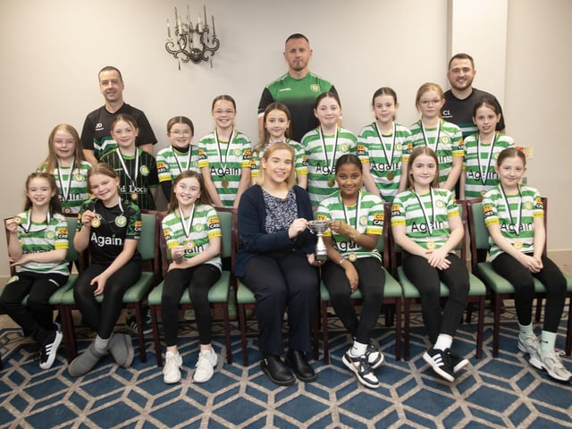 Top of the Hill Celtic u-11s receive the Summer Cup from Kerri Pyne, Derry Credit Union, at the D&D Youth FA awards at the Waterfoot Hotel on Sunday night last. Included are coaches Caoimhinn Lavery, Jason Doherty and Owen Morrison. (Photos: Jim McCafferty Photography)