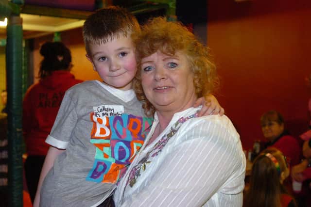 Agnes pictured in years past with her grandson Callum on his birthday at Bananas. (2102PG77)