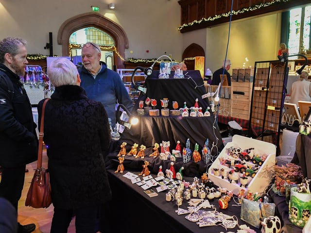 People browse the large range of gifts at the Guildhall Christmas Fair on Friday afternoon. Photo: George Sweeney / Derry Journal