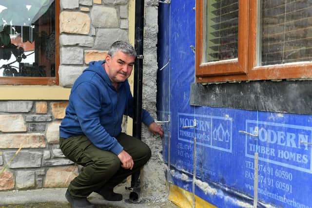 Danny Rafferty pictured beside some of the defective blocks used to build his home. Photo: George Sweeney