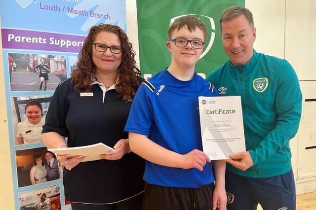 Keigan Taylor receiving a certificate for taking part in the FAI trials, from Paul Smyth (FAI) and Tessa Van Heerdan, who helped with the organising.