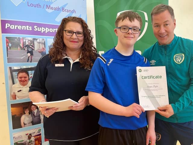 Keigan Taylor receiving a certificate for taking part in the FAI trials, from Paul Smyth (FAI) and Tessa Van Heerdan, who helped with the organising.