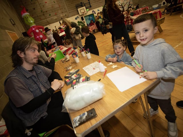 Local children taking part in the Arts and Crafts at Saturday's 'Christmas Get Together'. : .