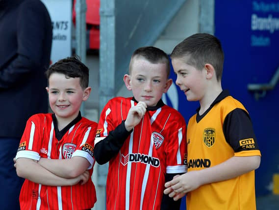 Young fans discuss tactics at the Brandywell, on Friday evening, for Derry City’s game against Drogheda United. Photo: George Sweeney. DER2314GS – 33
