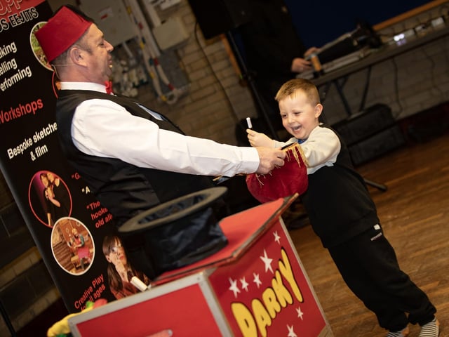Young Kian Grant working with Party The Magician on Saturday at Pilot's Row. : .