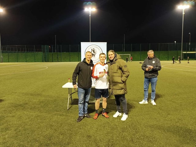 Oran McLaughlin collecting the participation trophy for Steve's Spurs from Derry City Manager Ruaidhrí Higgins. Colly McLaughlin of GCR is also pictured.