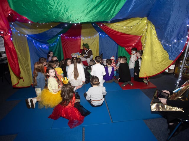 Mr. McLaughlin reading to the boys and girls in the Story Tent at Steelstown PS.
