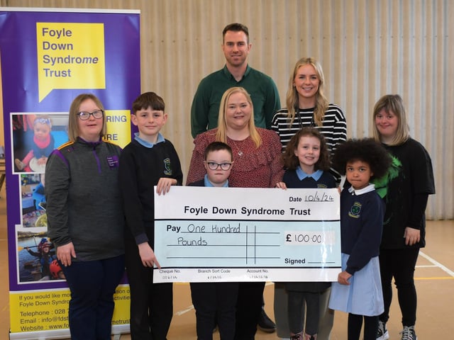 Ashlea Primary and Nursery School presented a £100,collected by pupils, to Foyle Down Syndrome Trust this week. Pictured are Eve, Foyle Down Syndrome Trust, pupils Rogan, Will, Katherine and Perrie, and Laura, Foyle Down Syndrome Trust. Included in the picture are Christopher Cooper, manager Foyle Down Syndrome Trust, Mrs A. Burke, principal and Miss R. Cummings, teacher. Photo: George Sweeney