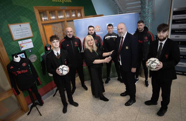 Mrs. Ciara Deane, Principal, St. Joseph's Boys School, Derry pictured welcoming Mr. John Shiels, Chief Executive Officer, Manchester United Foundation to the school on Thursday morning last. Included from left are Damian O'Kane, Year 14 student, Stephen Parkhouse, Matthew Lewsley, MUF, Mr. Emmett McGinty, PE teacher, Ciaran Donnelly, MUF and Darwen Spencer, Year 14. (Photos: Jim McCafferty Photography)