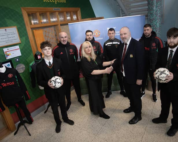 Mrs. Ciara Deane, Principal, St. Joseph's Boys School, Derry pictured welcoming Mr. John Shiels, Chief Executive Officer, Manchester United Foundation to the school on Thursday morning last. Included from left are Damian O'Kane, Year 14 student, Stephen Parkhouse, Matthew Lewsley, MUF, Mr. Emmett McGinty, PE teacher, Ciaran Donnelly, MUF and Darwen Spencer, Year 14. (Photos: Jim McCafferty Photography)