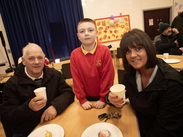 Primary 4 pupil Caolan Coyle pictured with granda Charlie and mum Caoimhe at Friday's Coffee Morning in Steelstown Primary School.