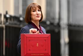 Chancellor of the Exchequer, Rachel Reeves, poses with the red Budget Box as she leaves 11 Downing Street to present the government's annual budget to Parliament on October 30, 2024 in London, England. This is the first Budget presented by the new Labour government and Chancellor of the Exchequer, Rachel Reeves. (Photo by Leon Neal/Getty Images)