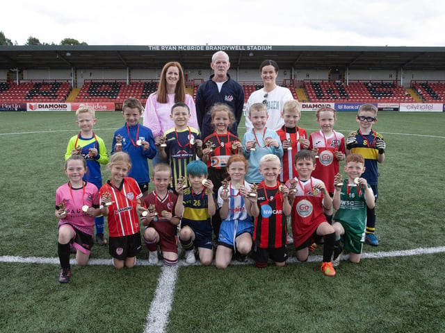 Club players of the tournament in the Ryan McBride Soccer Tournament played at the Brandywell on Wednesday as part of Feile 23. Included at back are Siounin McBride, Ryan's sister, his dad Lexie McBride, and Colleen McCay, Ryan's sister. (Photos: JIm McCafferty Photography)