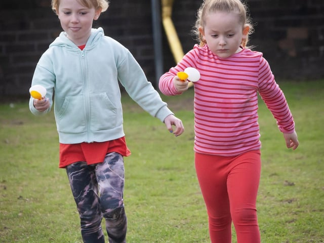 These two young ladies are making strides in the Egg and Spoon Race.