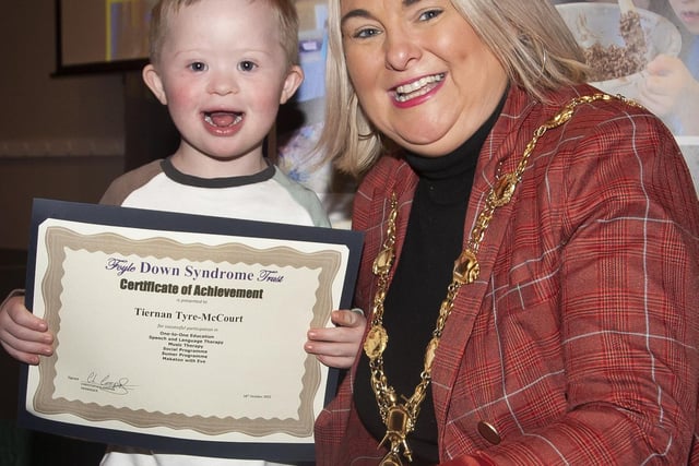 The Mayor Sandra Duffy presents young Tiernan Tyre-McCourt with his award.