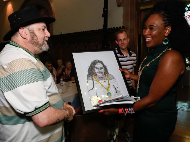 Paul Heron presents a framed drawing to Mayor Lilian Seenoi Barr at the Mayor's final Tea Dance held in the Guildhall. (Photo - Tom Heaney, nwpresspics)