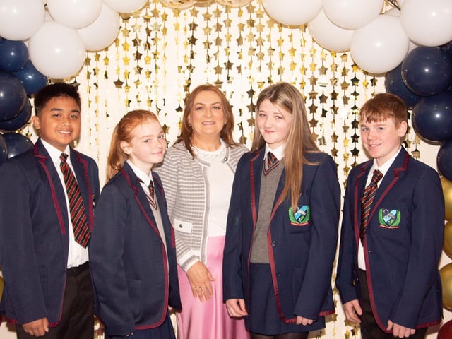 Mrs Kelly, Year Head, pictured welcoming Kurt Mangalile, Raci Moore Emma-Jayne Hamilton and Kaleb McCusker on their first day to Oakgrove Integrated College on Monday. : Oakgrove Integrated College welcomes latest influx of Year 8 pupils