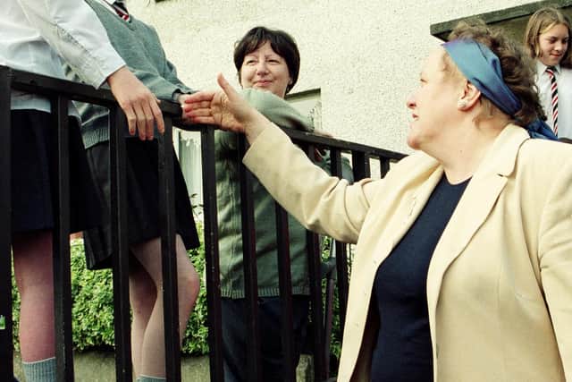 Mo mOwlam meeting children in the Fountain estate in the 1990s. (Picture Hugh Gallagher)