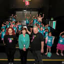 Ollie Green, from Studio 2, and Geraldine Dougan (centre), from Radius Housing Association, pictured with some of the children and volunteers from across the community who participated in the week long Good Relations, arts based, Summer Camps held at Studio. Photo: George Sweeney