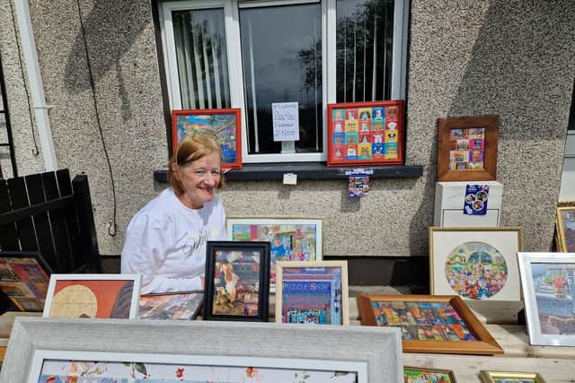 Monica Duffy with some of the jigsaws she is selling in aid of the Foyle Hospice.