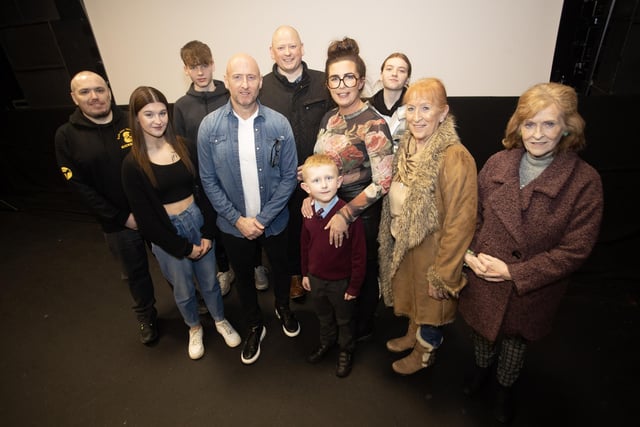 'Rath Mór Warriors kickboxing coach Sean McGill pictured with his family after Monday night's film premiere at the Nerve Centre, Derry.