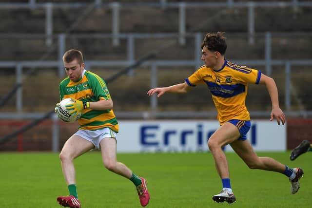 Glenullin ‘s Cormac Hasson is chased by Limavady’s John Butcher, during the IFC game in Celtic Park on Sunday afternoon. Photo: George Sweeney