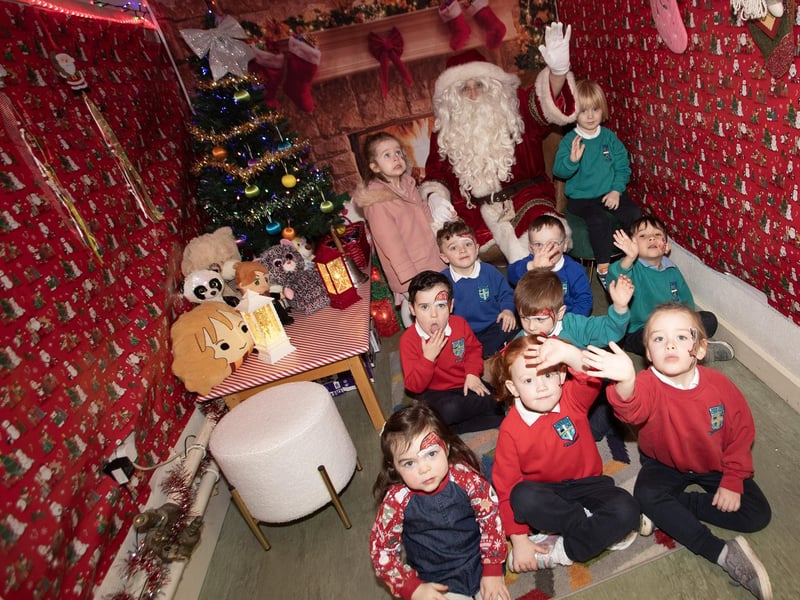OPEN DAY AT HOLLYBUSH PS. . . .Santa Claus welcoming some of the prospective pupils to the Hollybush PS Open Day on Thursday last at the school. (Photos: Jim McCafferty Photography)