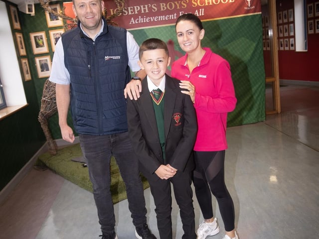 St. Joseph's student Conor Ward pictured with parents Michaela and Johnny on his first day on Monday. : St. Joseph's Boys School welcomes latest influx of Year 8 pupils