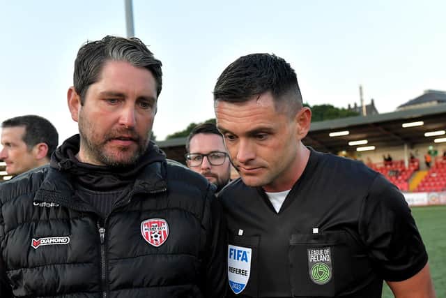 Derry City manager Ruaiddhri Higgins speaks with referee Rob Hennessy after the final whistle. DER2321GS -
