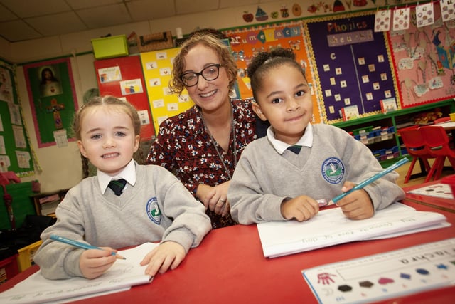 Mrs. McLaughlin, P1 teacher pictured with pupils Clodagh and Miya on Thursday. (Photos: Jim McCafferty Photography)