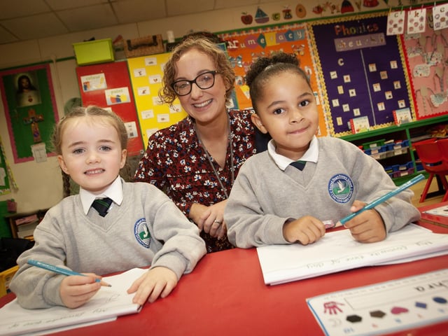 Mrs. McLaughlin, P1 teacher pictured with pupils Clodagh and Miya on Thursday. (Photos: Jim McCafferty Photography)