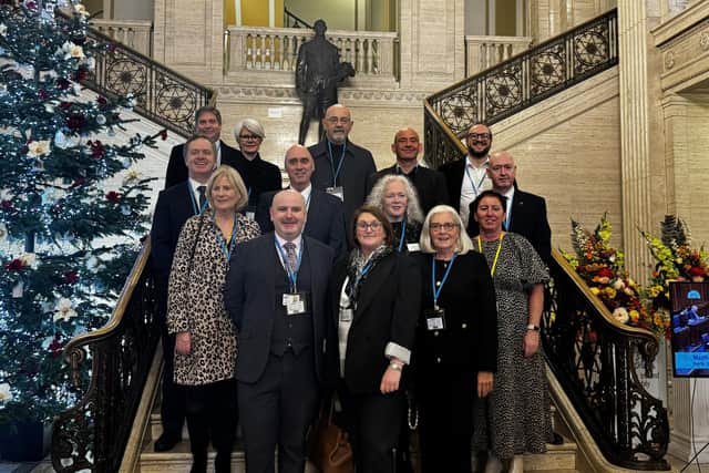 Members of Hospice Alliance NI on the steps of Parliament Buildings, Stormont, ahead of the launch of the Assembly’s Report on Access to Palliative Care Services