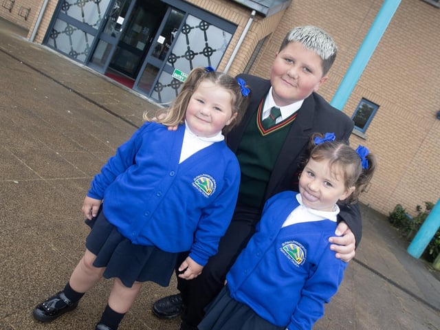 Year 8 student Caidan Ferry pictured with his two wee sisters Cliodhna and Cadhla as he arrives for this first day at St. Joseph's on Monday. (Photos: JIm McCafferty Photography) : St. Joseph's Boys School welcomes latest influx of Year 8 pupils
