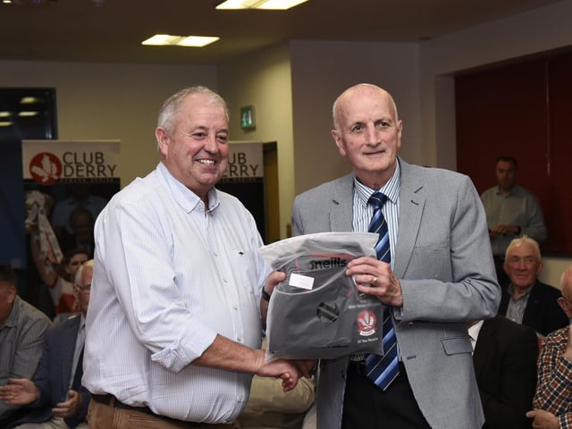 Derry Co. Chairman John Keenan makes a presentation to Lavey's Eugene Laverty at the 1975 / 76 Ulster SFC Winners reunion in Owenbeg on Friday.