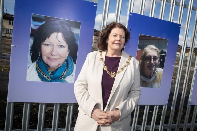 The Mayor, Patricia Logue at the launch of the exhibition on Monday. She is pictured beside portraits of the late Roisin Barton and Kitty Rowe.