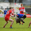 Cavan's Joshua Shehu attempts to dive past Derry trio Eamon Young, Gabhan McIvor and Caoimhin Hargan . Photo: George Sweeney