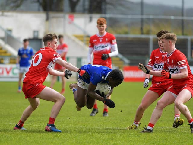 Cavan's Joshua Shehu attempts to dive past Derry trio Eamon Young, Gabhan McIvor and Caoimhin Hargan . Photo: George Sweeney