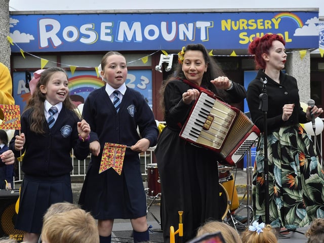 Pupils from Rosemount Primary School sing with the Jive Aces during the band’s visit to the school on Thursday morning. Photo: George Sweeney