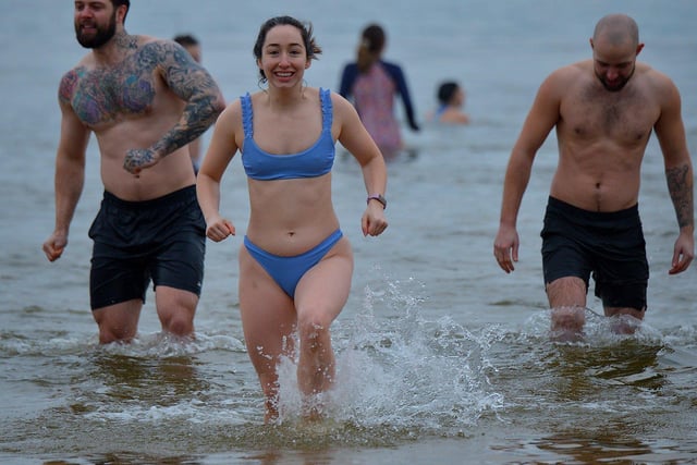 Swimmers enjoy taking part in the annual ARC Fitness New Year's Day Charity Swim at Lisfannon beach.  Photo: George Sweeney. DER2301GS  07