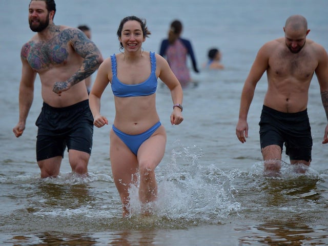Swimmers enjoy taking part in the annual ARC Fitness New Year's Day Charity Swim at Lisfannon beach. Photo: George Sweeney. DER2301GS 07