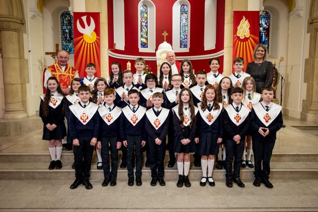 Pupils from Mrs Doherty's Class, St Patrick's Primary School, pictured at their confirmation at St Patrick's Chapel, Pennyburn. Included, are Fr Noel McDermott, and Fr Michael McCaughey.(Stephen Latimer)