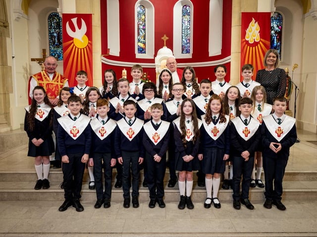 Pupils from Mrs Doherty's Class, St Patrick's Primary School, pictured at their confirmation at St Patrick's Chapel, Pennyburn. Included, are Fr Noel McDermott, and Fr Michael McCaughey.(Stephen Latimer)