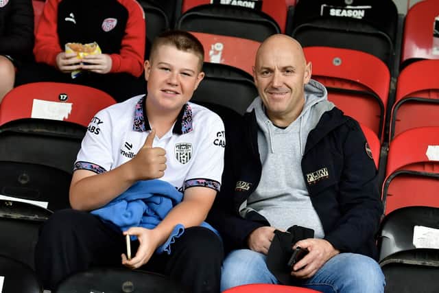 Thumbs up from this young Derry fans sporting the team's goalkeeper jersey.