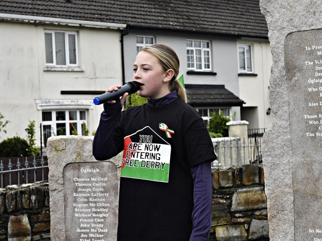 Eleven-year-old Anaiah McLaughlin sings Amhrán na bhFiann at the Creggan Republican Monument during a commemoration on Easter Sunday afternoon. Photo: George Sweeney