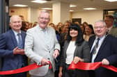 Paul Bartholomew, Vice Chancellor at Ulster University, Health Minister, Mike Nesbitt, Professor and Shahneela Grygiel, Assistant Director of Registration and Revalidation at the Nursing and Midwifery Council and Deputy Mayor of Derry City and Strabane District Council, Darren Guy cutting the ribbon at the Official Launch of the New Nursing Competence Test Centre located at Foyle House in Derry.